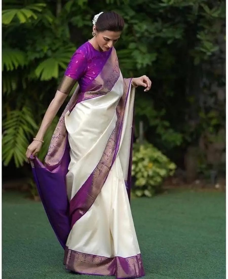 white and purple silk saree, often described as a Banarasi or Kanjivaram silk blend, featuring a rich woven border and contrast pallu